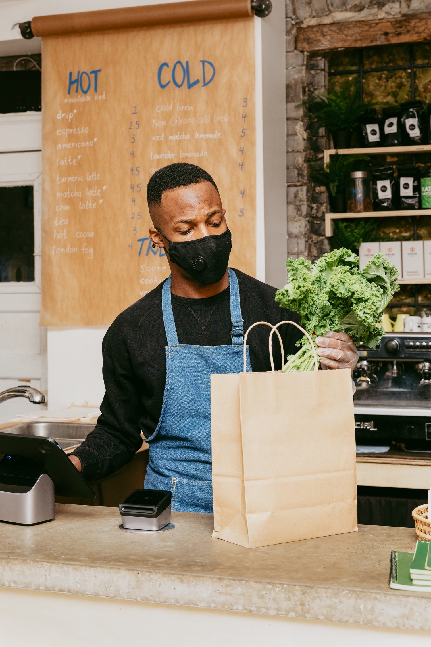 Man placing groceries into a bag