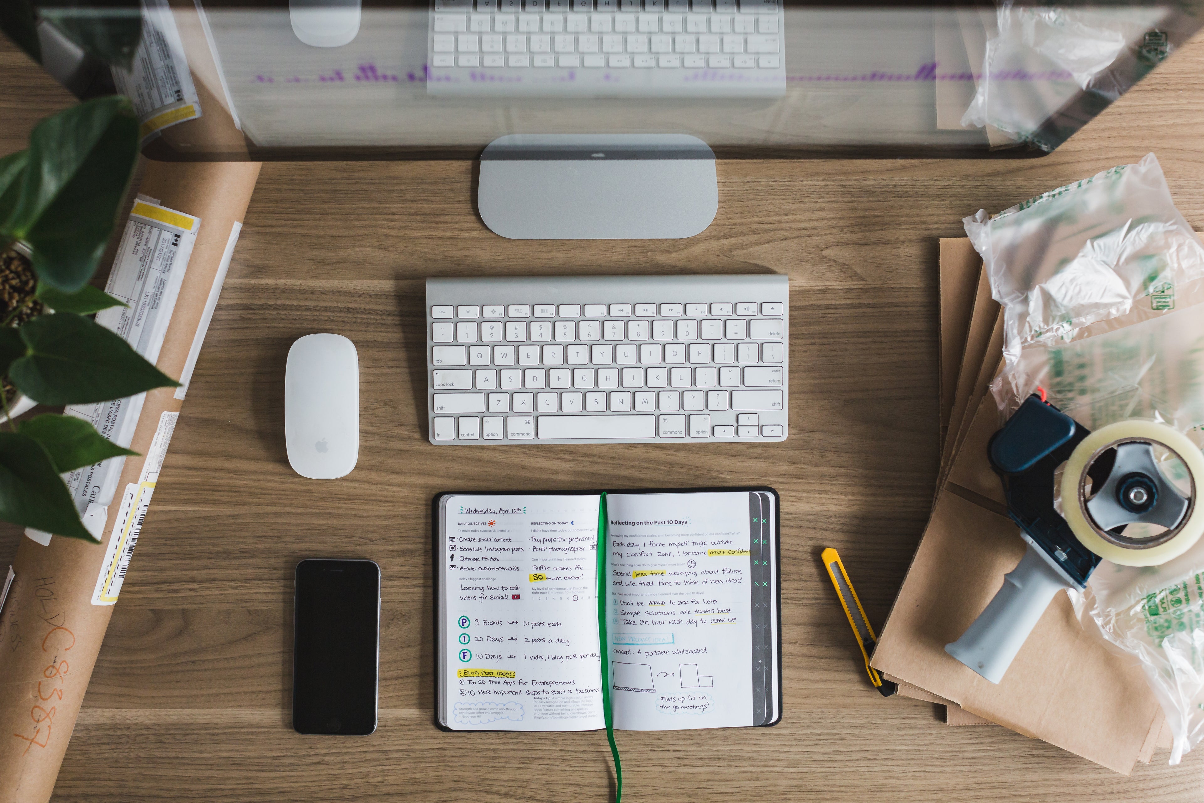 Desk with an open book and computer